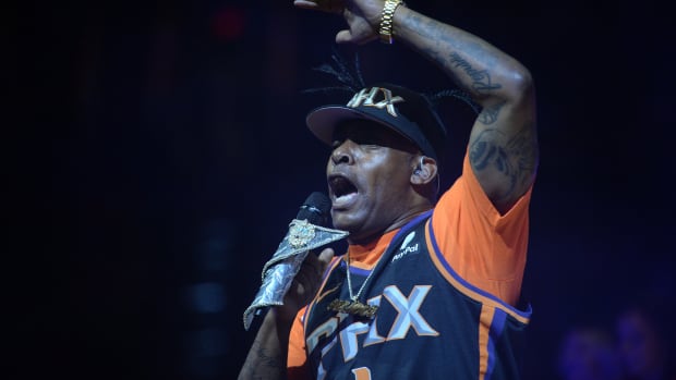 Grammy Award winner Coolio performing at a Phoenix Suns basketball game.