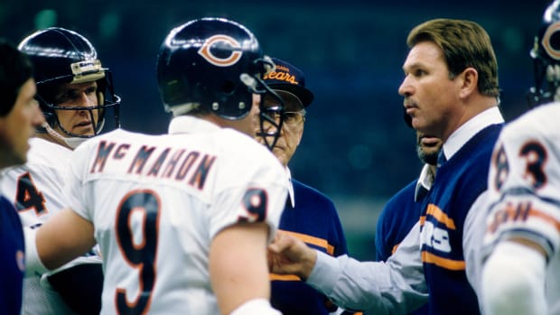 Jan 26, 1986; New Orleans, LA, USA; FILE PHOTO; Chicago Bears head coach Mike Ditka (right) and offensive coordinator Ed Hughes (center) talk to quarterbacks Jim McMahon (9) and Steve Fuller (4) during Super Bowl XX against the New England Patriots at the Superdome. The Bears defeated the Patriots 46-10. Mandatory Credit: Manny Rubio-USA TODAY Sports