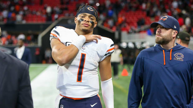 Nov 20, 2022; Atlanta, Georgia, USA; Chicago Bears quarterback Justin Fields (1) walks off the field with medical personnel after a game against the Atlanta Falcons at Mercedes-Benz Stadium.