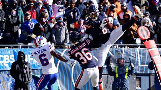 Dec 24, 2022; Chicago, Illinois, USA; Chicago Bears cornerback Kyler Gordon (6) makes an interception against Buffalo Bills wide receiver Isaiah McKenzie (6) during the second quarter at Soldier Field. Mandatory Credit: Mike Dinovo-USA TODAY Sports