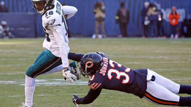 Dec 18, 2022; Chicago, Illinois, USA; Philadelphia Eagles wide receiver Quez Watkins (16) makes a catch against Chicago Bears cornerback Jaylon Johnson (33) during the second half at Soldier Field. Mandatory Credit: Mike Dinovo-USA TODAY Sports