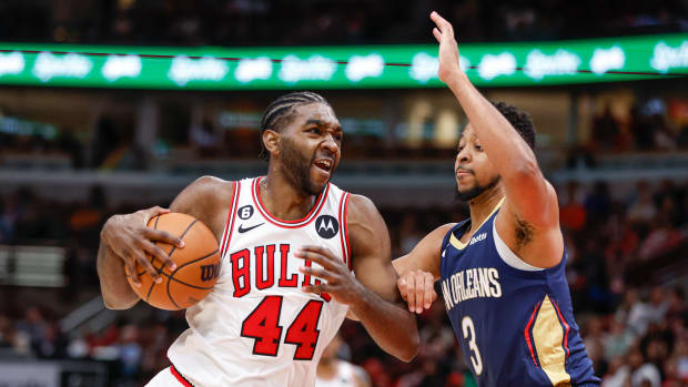 Oct 4, 2022; Chicago, Illinois, USA; Chicago Bulls forward Patrick Williams (44) drives to the basket against New Orleans Pelicans guard CJ McCollum (3) during the second half of a preseason NBA basketball game at United Center.