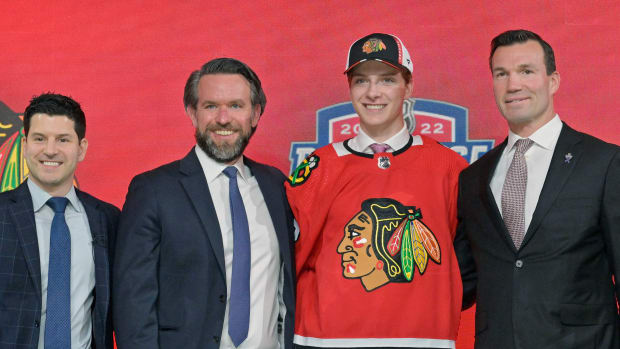 Jul 7, 2022; Montreal, Quebec, CANADA; Kevin Korchinski after being selected as the number seven overall pick to the Chicago Blackhawks in the first round of the 2022 NHL Draft at Bell Centre.
