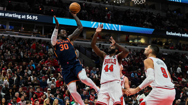 Dec 16, 2022; Chicago, Illinois, USA; New York Knicks forward Julius Randle (30) shoots past Chicago Bulls forward Patrick Williams (44) and Chicago Bulls center Nikola Vucevic (9) during the second half at the United Center.