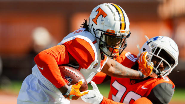 Feb 5, 2022; Mobile, AL, USA; American squad wide receiver Velus Jones Jr. of Tennessee (1) and National Squad cornerback Joshua Williams of Fayetteville State (30) in the first half during the Senior bowl at Hancock Whitney Stadium. Mandatory Credit: Nathan Ray Seebeck-USA TODAY Sports