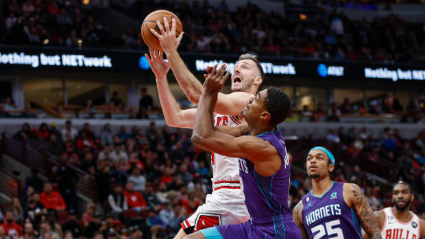 Nov 2, 2022; Chicago, Illinois, USA; Chicago Bulls guard Goran Dragic (7) goes to the basket against Charlotte Hornets guard Theo Maledon (9) during the first half at United Center.