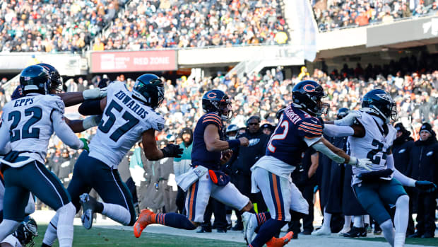 Dec 18, 2022; Chicago, Illinois, USA; Chicago Bears quarterback Justin Fields (1) rushes the ball against the Philadelphia Eagles during the second half at Soldier Field. Mandatory Credit: Mike Dinovo-USA TODAY Sports
