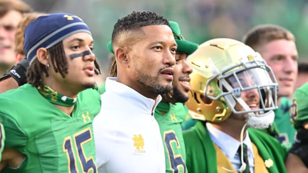 Sep 17, 2022; South Bend, Indiana, USA; Notre Dame Fighting Irish head coach Marcus Freeman stands with his players and the Notre Dame Leprechaun after Notre Dame defeated the California Bears at Notre Dame Stadium.