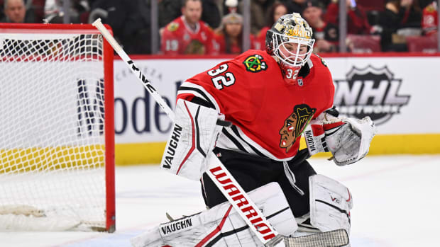 Jan 14, 2023; Chicago, Illinois, USA; Chicago Blackhawks goaltender Alex Stalock (32) makes a save with his blocker in the second period against the Seattle Kraken at United Center.