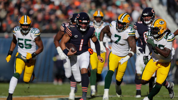 Chicago Bears quarterback Justin Fields runs against the