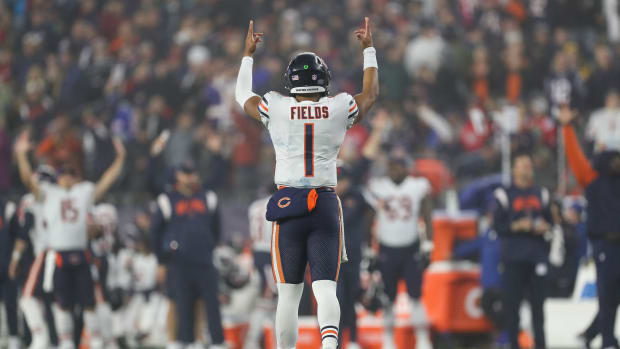 Oct 24, 2022; Foxborough, Massachusetts, USA; Chicago Bears quarterback Justin Fields (1) celebrates after a touchdown during the second half against the New England Patriots at Gillette Stadium. Mandatory Credit: Paul Rutherford-USA TODAY Sports