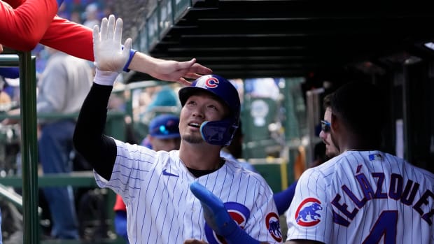 Seiya Suzuki of the Chicago Cubs walks back to the dugout after