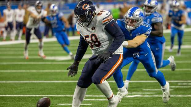 Nov 19, 2023; Detroit, Michigan, USA; Detroit Lions defensive end Aidan Hutchinson (97) and Chicago Bears offensive tackle Darnell Wright (58) chase after the loose ball late in the fourth quarter at Ford Field.