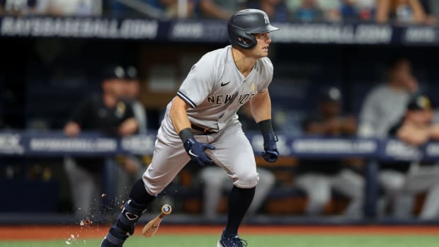 Sep 2, 2022; St. Petersburg, Florida, USA; New York Yankees left fielder Andrew Benintendi (18) doubles against the Tampa Bay Rays in the first inning at Tropicana Field.