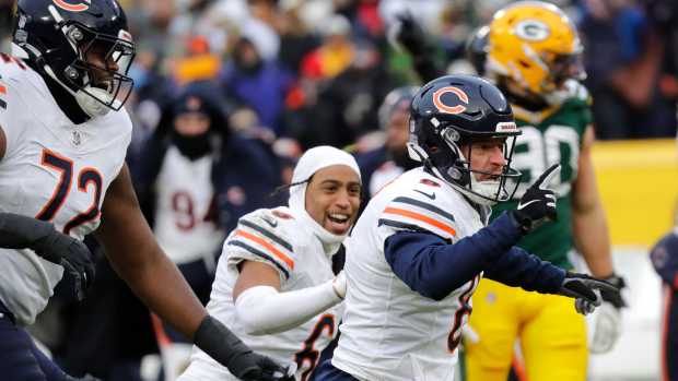 Jan 5, 2025; Green Bay, Wisconsin, USA; Chicago Bears place kicker Cairo Santos (8) celebrates his 51-yard game-winning field goal against the Chicago Bears during their football game Sunday, January 5, 2025 at Lambeau Field. 