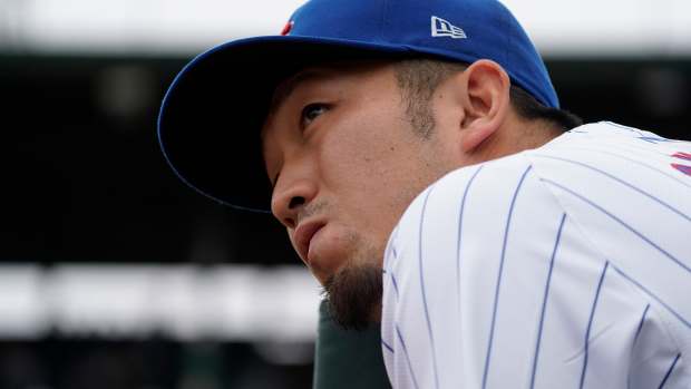 Sep 27, 2024; Chicago, Illinois, USA; Chicago Cubs outfielder Seiya Suzuki (27) in the dugout during the first inning in a game against the Cincinnati Reds at Wrigley Field.