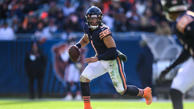 Nov 13, 2022; Chicago, Illinois, USA; Chicago Bears quarterback Justin Fields (1) scrambles right in the third quarter against the Detroit Lions at Soldier Field.