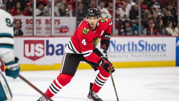 Jan 1, 2023; Chicago, Illinois, USA; Chicago Blackhawks defenseman Seth Jones (4) skates with the puck against the San Jose Sharks during the second period at the United Center.