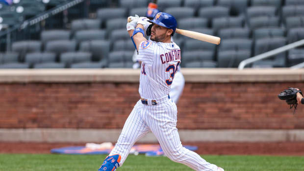 Apr 25, 2021; New York City, New York, USA; New York Mets right fielder Michael Conforto (30) hits a double during the bottom of the fourth inning against the Washington Nationals at Citi Field.