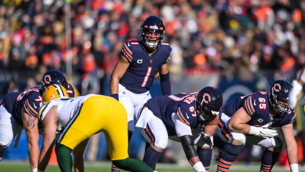 Dec 4, 2022; Chicago, Illinois, USA; Chicago Bears quarterback Justin Fields (1) stands over center in the first quarter against the Green Bay Packers at Soldier Field. Mandatory Credit: Daniel Bartel-USA TODAY Sports