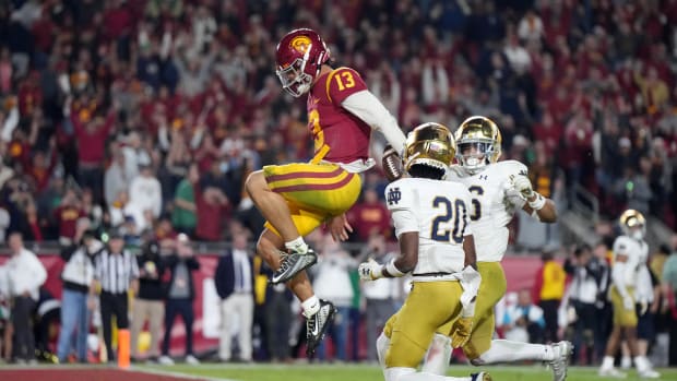 Nov 26, 2022; Los Angeles, California, USA; Southern California Trojans quarterback Caleb Williams (13) celebrates after rushing for a touchdown against the Notre Dame Fighting Irish in the second half at United Airlines Field at Los Angeles Memorial Coliseum.