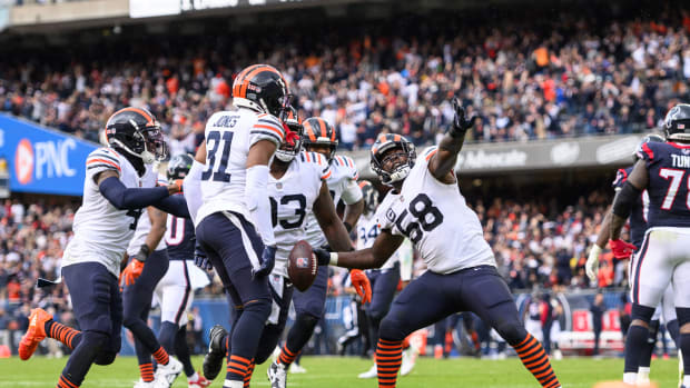 Sep 25, 2022; Chicago, Illinois, USA; Chicago Bears inside linebacker Roquan Smith (58) throws the ball into the stands after an interception in the fourth quarter against the Houston Texans at Soldier Field. Mandatory Credit: Daniel Bartel-USA TODAY Sports