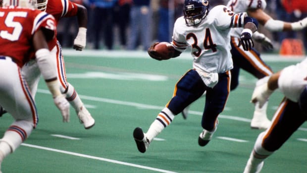 Jan 26, 1986; New Orleans, LA, USA; FILE PHOTO; Chicago Bears running back Walter Payton (34) carries the ball during Super Bowl XX against the New England Patriots at the Superdome. The bears defeated the Patriots 46-10.