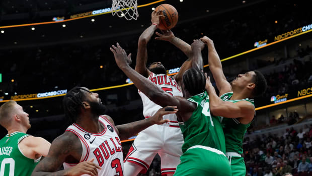 Oct 24, 2022; Chicago, Illinois, USA; Chicago Bulls forward Derrick Jones Jr. (5) goes up for a shot on Boston Celtics forward Noah Vonleh (4) during the first half at United Center.
