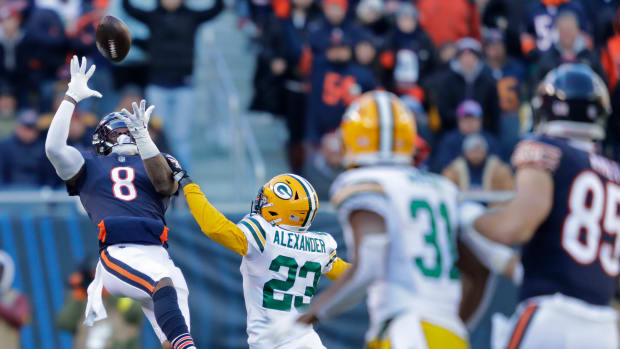 Dec 4, 2022; Chicago, Illinois, USA; Chicago Bears wide receiver N'Keal Harry (8) pulls down a 49-yard reception aginst Green Bay Packers cornerback Jaire Alexander (23) in the fourth quarter during their football game at Soldier Field. Mandatory Credit: Dan Powers-USA TODAY Sports