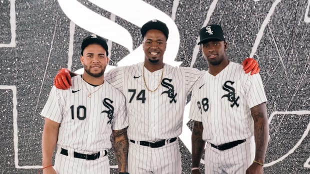 Chicago White Sox players Yoan Moncada, Eloy Jimenez, and Luis Robert pose for a photo