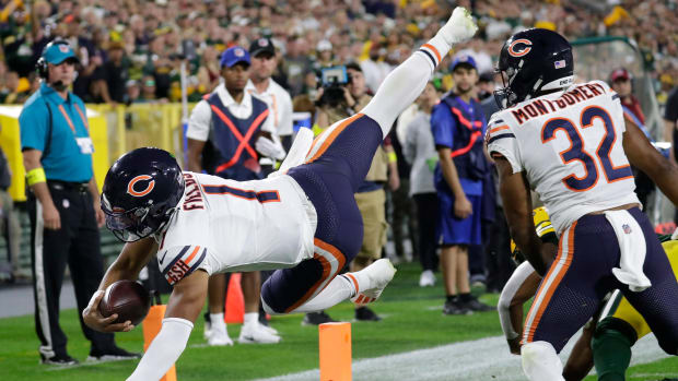 Sep 18, 2022; Green Bay, Wisconsin, USA; Chicago Bears quarterback Justin Fields (1) dives into the end zone for touchdown against the Green Bay Packers in the first quarter during their football game at Lambeau Field. Dan Powers/USA TODAY NETWORK-Wisconsin Nfl Chicago Bears At Green Bay Packers