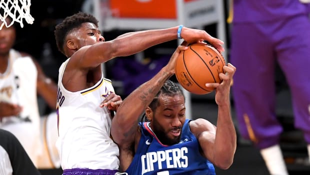 Dec 11, 2020; Los Angeles, California, USA; Los Angeles Lakers forward Kostas Antetokounmpo (37) battles Los Angeles Clippers forward Kawhi Leonard (2) for a rebound in the first half of the game at Staples Center.