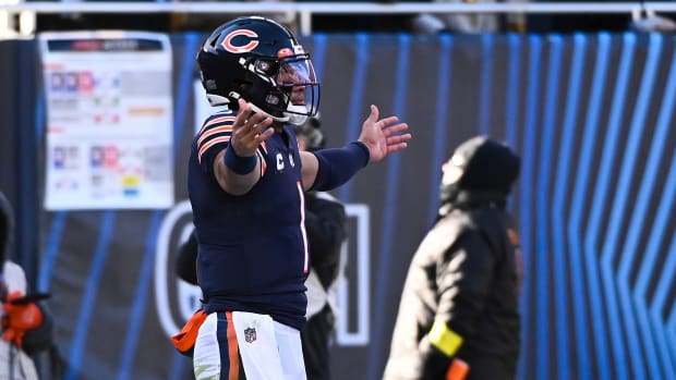 Dec 4, 2022; Chicago, Illinois, USA; Chicago Bears quarterback Justin Fields (1) celebrates after scoring a touchdown against the Green Bay Packers during the first half at Soldier Field.