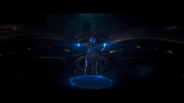 Johnathan Majors makes his first appearance as Kang the Conqueror. His blue glowing hands and floating platform are set against a dark background.