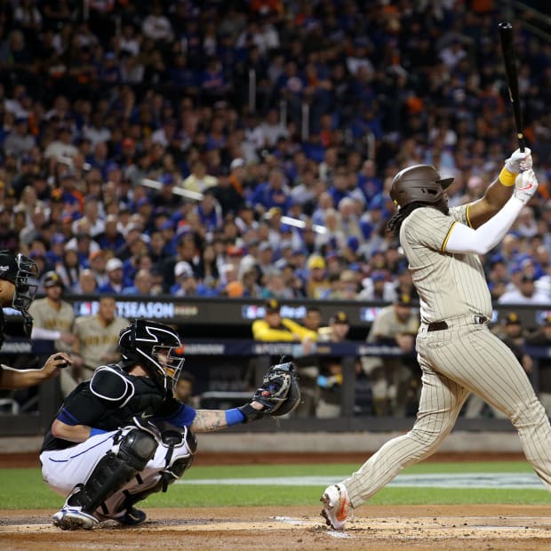 Oct 7, 2022; New York City, New York, USA; San Diego Padres first baseman Josh Bell (24) hits a two run home run against the New York Mets in the first inning during game one of the Wild Card series for the 2022 MLB Playoffs at Citi Field.