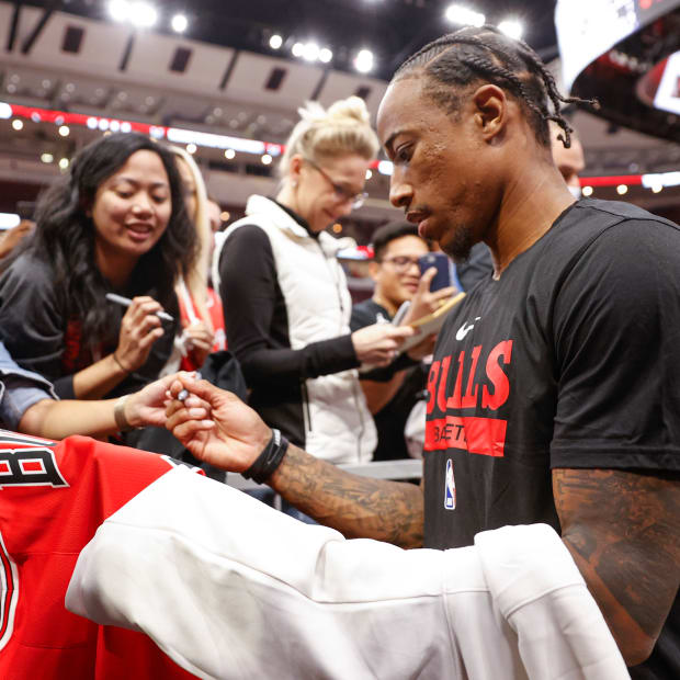 Oct 4, 2022; Chicago, Illinois, USA; Chicago Bulls forward DeMar DeRozan (11) signs autographs before a preseason NBA basketball game against the New Orleans Pelicans at United Center.