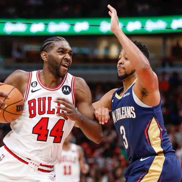 Oct 4, 2022; Chicago, Illinois, USA; Chicago Bulls forward Patrick Williams (44) drives to the basket against New Orleans Pelicans guard CJ McCollum (3) during the second half of a preseason NBA basketball game at United Center.