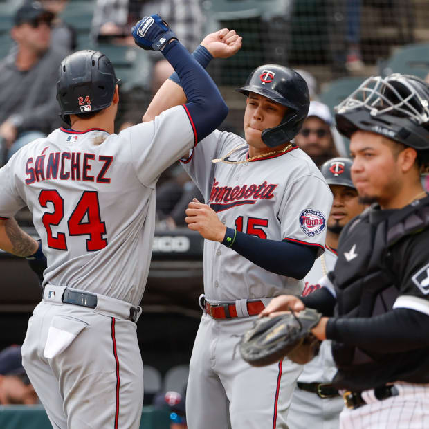 Oct 5, 2022; Chicago, Illinois, USA; Minnesota Twins catcher Gary Sanchez (24) celebrates with third baseman Gio Urshela (15) after hitting a three-run home run against the Chicago White Sox during the first inning at Guaranteed Rate Field.