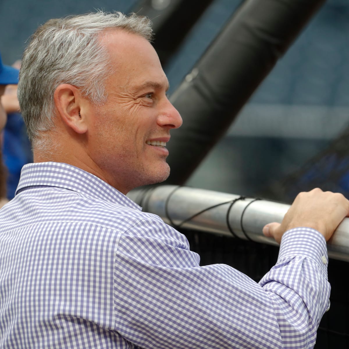 President Jed Hoyer of the Chicago Cubs presents a jersey to