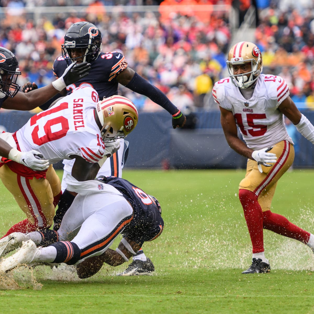 Heavy rain floods Soldier Field during Chicago Bears' season opener against  San Francisco 49ers