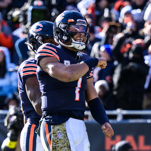 Nov 13, 2022; Chicago, Illinois, USA; Chicago Bears quarterback Justin Fields (1) celebrates his rushing touchdown in the second quarter against the Detroit Lions at Soldier Field.