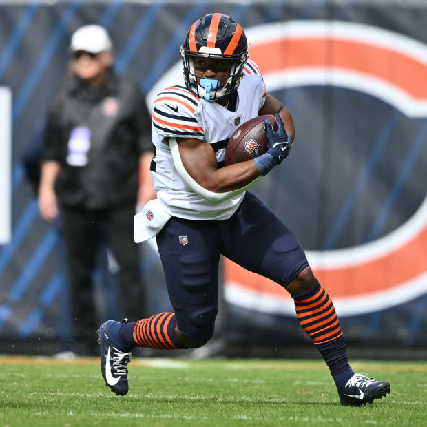 Sep 25, 2022; Chicago, Illinois, USA; Chicago Bears running back Khalil Herbert (24) looks for running room after catching a pass in the first quarter against the Houston Texans at Soldier Field.