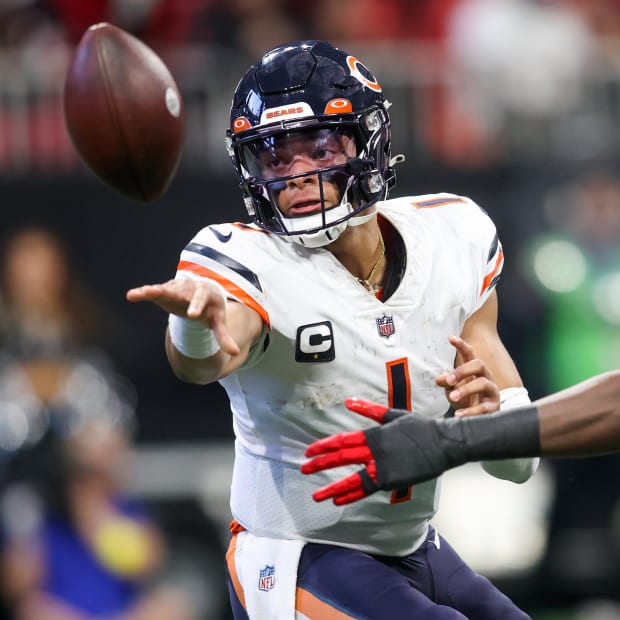 Nov 20, 2022; Atlanta, Georgia, USA; Chicago Bears quarterback Justin Fields (1) pitches the ball against the Atlanta Falcons in the second half at Mercedes-Benz Stadium.
