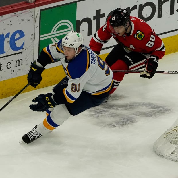 Feb 27, 2022; Chicago, Illinois, USA; Chicago Blackhawks right wing Patrick Kane (88) defends St. Louis Blues right wing Vladimir Tarasenko (91) during the first period at United Center.