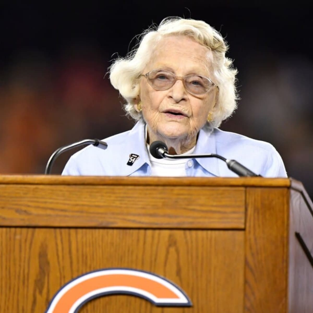 Chicago Bears chairman Michael McCaskey, left, and owner Virginia McCaskey  , center, react as they are presented with the George Halas Trophy after  the Bears beat the New Orleans Saints, 39-14, to