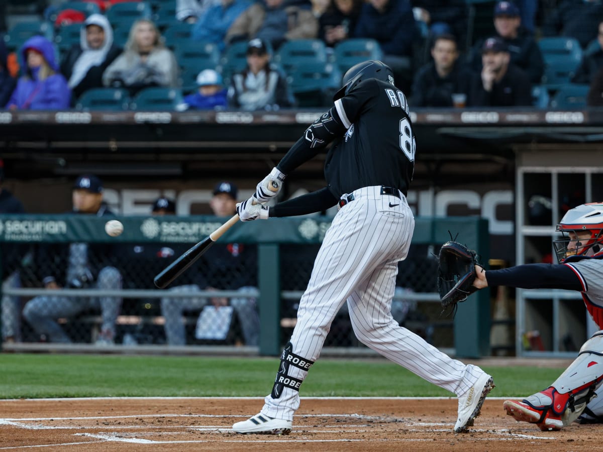 Luis Robert Jr. #88 of the Chicago White Sox reacts after hitting