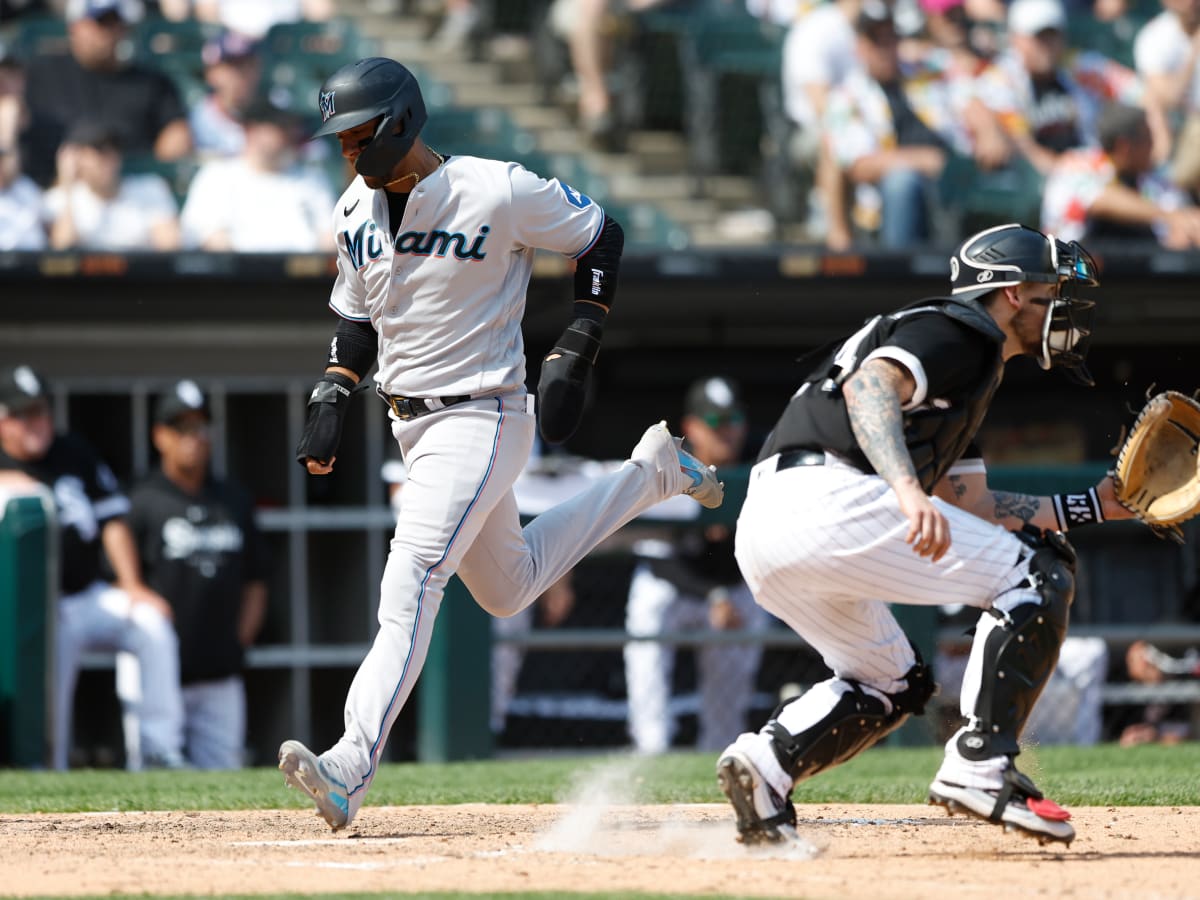 Miami Marlins' Jean Segura (9) hits a single to score the winning run  during the ninth inning of a baseball game against the Chicago Cubs,  Friday, April 28, 2023, in Miami. The