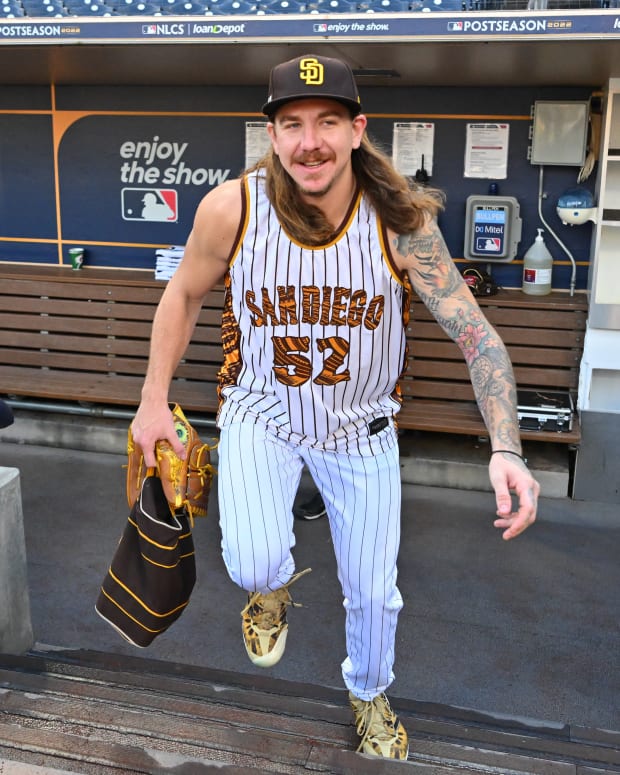Oct 19, 2022; San Diego, California, USA; San Diego Padres starting pitcher Mike Clevinger (52) runs on the field for batting practice before the game against the Philadelphia Phillies during game two of the NLCS for the 2022 MLB Playoffs at Petco Park.