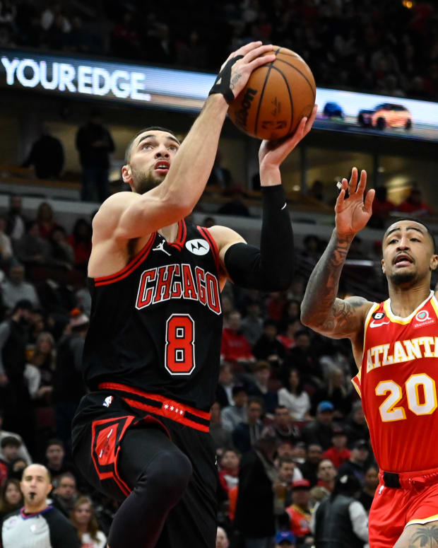 Jan 23, 2023; Chicago, Illinois, USA; Chicago Bulls guard Zach LaVine (8) goes to the basket against Atlanta Hawks forward John Collins (20) during the first half at the United Center.