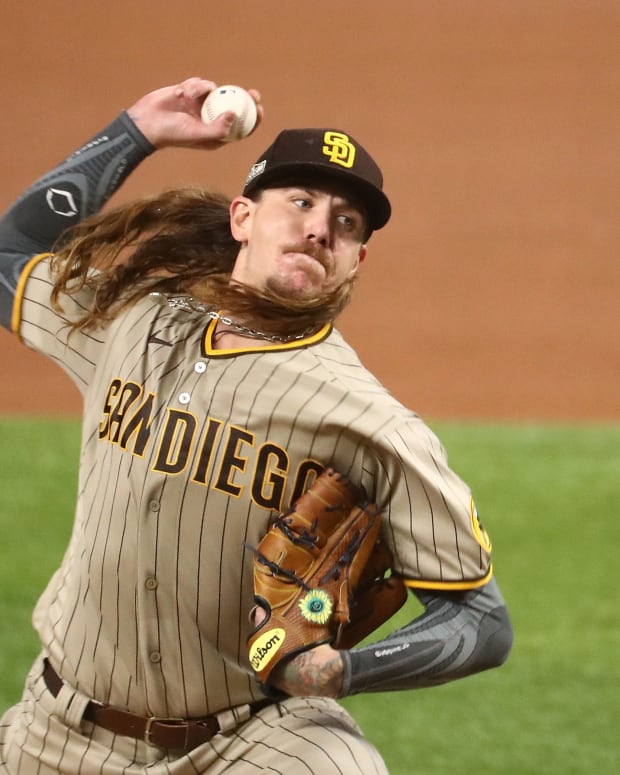 Oct 6, 2020; Arlington, Texas, USA; San Diego Padres starting pitcher Mike Clevinger (52) pitches against the Los Angeles Dodgers during the first inning in game one of the 2020 NLDS at Globe Life Field.